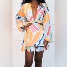 Nwot Long-Sleeved Cut-Out Romper. Size Medium. Lined. Purchased From Online Boutique, Arrived W/O Tags. Never Worn. Orange Multi-Colored. Runs True To Size. Spring V-neck Mini Dress With Abstract Print, Spring Chic Mini Dress With Abstract Print, Fitted Long Sleeve Mini Dress With Abstract Print, Multicolor Long Sleeve Dress For Brunch, Multicolor Printed Long Sleeve Mini Dress, Multicolor Long Sleeve Printed Mini Dress, Spring Mini Dress With Abstract Print And V-neck, Long Sleeve Printed Mini Dress For Vacation, Printed Long Sleeve Mini Dress For Vacation