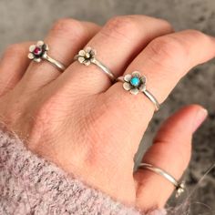 Embrace your inner flower child with this Floral Ring featuring a beautiful American Mined turquoise from Arizona in the center, perfect for everyday wear. Made of sterling silver, this customizable ring is sure to match your unique style. A must-have accessory for nature lovers, festival goers, and those who love all things 60s and 70s. * 925 sterling silver * American Mined Turquoise* Handmade in our studio in WA state. This piece will be made to order according to your ring size, and will shi Hippie Weddings, Wa State, Hippie Wedding, Daisy Ring, Floral Ring, Festival Jewelry, 70s Inspired, Flower Child, Stackable Rings