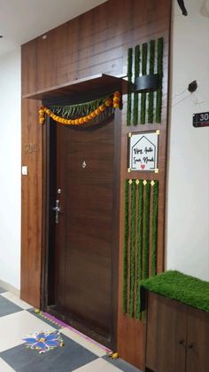 an entrance decorated with grass and flowers