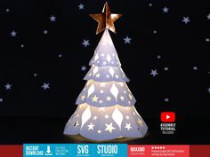 a white christmas tree with gold stars on it and the words svg studio above it