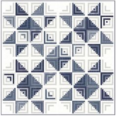 a blue and white quilt with squares on it