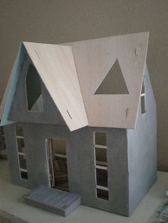 a model house is sitting on a table