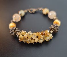 Handmade beaded cluster bracelet of natural faceted Gold Tiger's eye , genuine Rutilated quartz. Bronze accents.  Fits for 15.5-16.5cm wrist.  The bracelet comes in a gift box ready for gifting. You might also like earrings  https://www.etsy.com/uk/shop/LoveIuliia?ref=l2-about-shopname§ion_id=38529364 Not exactly what you are looking for? More of bracelets available here https://www.etsy.com/uk/shop/LoveIuliia?ref=l2-about-shopname§ion_id=38541683 Thank you so much for visiting my shop Iuliia xx Hand-strung Amber Bracelet Jewelry, Hand-strung Amber Bracelet, Artisan Bracelet With Faceted Beads, Yellow Faceted Beads Bracelet, Gold Bracelets With Faceted Beads, Artisan Faceted Bead Bracelet Jewelry, Elegant Handmade Amber Beaded Bracelets, Artisan Faceted Bead Bracelet, Brown Faceted Bead Bracelet