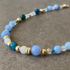 "Blue Apatite& Aquamarine & Moonstone & Quartz Bead Necklace ☆ Aquamarine and apatite are stone of courage.  Its calming energies reduce stress and quiet the mind.  Stones have an affinity with sensitive people.  They can invoke tolerance of others and overcomes judgmentalism, giving support to those overwhelmed by responsibility.  ☆ For the bracelet: https://www.etsy.com/listing/1472932795/blue-aquamarine-bracelet-men-blue ☆ Along with this necklace you have bought, an earring that matches its color is also a gift! ☆ Arrives ready for gifting and usually ships same day or next day. The necklace will be sent with a gift! O T H E R ∙ I N F O R M A T I O N Blue Apatite size: 5-6mm Blue Aquamarine size: 8 mm Moonstone size: 5-6 mm White Auqrtz size: 3-4 mm **Intermediate apparatus and beads a Blue Agate Polished Bead Necklaces, Beaded Blue Gemstones For Jewelry Making, Blue Beaded Gemstones For Jewelry Making, Blue Agate Beaded Necklace With Polished Beads, Blue Amazonite Spiritual Necklaces, Blue Agate Polished Beads Necklace, Spiritual Blue Amazonite Necklace, Blue Spiritual Necklace With Spacer Beads, Blue Crystal Necklaces With Gemstone Round Beads