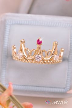 This sparking tiara design is simply a stunning princess promise ring, with it's dainty design and glimmering accents. This dream tiara ring features three gemstones at the base of the band and one at the peak of the crown, this ring can be personalized with gemstones and makes the perfect girlfriend gift. #Jewlr #PromiseRing #PrincessJewelry #PrincessRing #CrownRing #CrownJewelry #PersonalizedJewelry Princess Promise Rings, Princess Tiara Ring, Tiara Design, Perfect Girlfriend, Crown Rings, The Perfect Girlfriend, Crown Ring Princess, Aesthetic Jewellery, All The Princesses