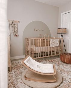 a baby's room with a rocking chair and crib