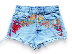 "Pre Loved  Denim cutoff shorts featuring embroidered flower appliqué,  high waist   silhouette with raw hem. Handmade embroidery  This is a unique item made with love in a friendly workspace ! All our products are handmade and constructed from pre existent materials that were either discarded or coming from vintage stores !!  All our clothing are made with recycled materials.   We all know how harmful clothing waste can be to our beloved planet, so help us spread upcycle love and buy clothing that is part of a solution rather than the cause of a problem. Welcome to our community !  Details :  MEDIUM  ligth wash  W27/28 *Rise: 11.5\" *Inseam: 2.5\" Pre - loved item ❤️" Bohemian Summer Jeans With Frayed Hem, Casual Embroidered Cutoff Shorts, Cotton Jean Shorts With Floral Embroidery, Floral Embroidered Cotton Jean Shorts, Trendy Jean Shorts For Spring Festival, Summer Bohemian Embroidered Jeans, Embroidered Cotton Cutoff Bottoms, Cutoff Cotton Jeans With Floral Embroidery, Cotton Cutoff Jeans With Floral Embroidery