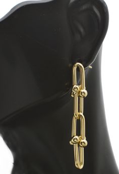 Experience luxury and elegance with our Real 14K Solid Yellow Gold Shiny Chain Link Hardware Drop Dangle Earrings. Crafted with high-quality 5.6 grams of solid gold, these earrings bring a touch of glamour to any outfit. The chain link hardware gives them a unique and modern twist, making them the perfect accessory for any occasion. Indulge in the timeless beauty and versatility of these exquisite earrings and elevate your style to the next level. A must-have for any jewelry collection.  Specifications: Metal: Real 14K Yellow Gold (Stamped, 14K) Condition: Brand New Polished: Shiny Weight: 5.6 grams Height: 2.01 Inches Width: 9.3mm Metal Details Type - 14k solid gold Drop Dangle Earrings, Gold Drop Earrings, Solid Yellow, Timeless Beauty, Chain Link, Solid Gold, Etsy Earrings, Dangle Drop Earrings, Jewelry Collection