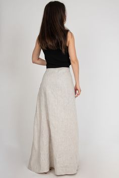 Summer Asymmetrical Gathered Skirt, Fitted Linen Maxi Skirt For The Beach, Elegant Full Maxi Skirt For Beach, Beige Asymmetrical Relaxed Skirt, Elegant Lined Maxi Skirt For Beach, Beige Maxi Skirt For Summer, Beige Relaxed Maxi Skirt For Summer, Beige Long Skirt For Summer, Summer Long Wrap Skirt With Gathered Details