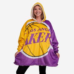 *SEP* *SEP* Never before has fandom looked so good and felt so relaxing. Lounge like a legend while you cheer your team on to victory by rocking this Los Angeles Lakers Reversible Colorblock Hoodeez. Features Dual team-colored design with bold team logo display on front so everyone knows who you're rooting for on gameday Miniature logo on bottom left of front for added team spirit Side seam pockets to store some extra fandom Team-colored hood so you can block the wind, and the haters Reverse sid Lakers Varsity Jacket, Lakers Shorts Women, Miniature Logo, Lakers Lamp, Lakers Sweatshirt, Lakers Merch, Sherpa Hoodie, Hoodie Blanket, Los Angeles Clippers