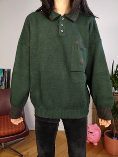 DESCRIPTION Vintage dark green polo collar knitted sweater made from 50% wool fabric. This thick pullover has a logo embroidery on the chest.  CONDITION This vintage knit is in great vintage condition with very light piling SIZING This vintage knit is estimated as size M and is labelled as size L > please check measurements below as all vintage sizes are different Measurements: Arms till shoulder seam: 47cm Shoulder till shoulder seam: 70cm Armpit to armpit: 62cm Back: 63cm Model is size XS/S and is 1m65 MATERIAL 50% wool 50% acryl Made in Italy WITH LOVE  All vintage items are washed/treated from Berlin with a lot of love As they are all one of a kind, they might have some small imperfections. The clear flaws will be described under condition. Your favourite online vintage clothing shop Green Long Sleeve Polo Sweater For Winter, Winter Wool Sweater With Polo Collar, Green Winter Polo Sweater With Ribbed Cuffs, Winter Green Polo Sweater With Ribbed Cuffs, Green Long Sleeve Polo Sweater With Ribbed Cuffs, Winter Polo Collar Sweater, Green Wool Sweater With Ribbed Collar, Casual Green Polo Sweater With Ribbed Cuffs, Winter Polo Sweater With Ribbed Cuffs