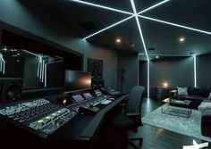 a recording studio with sound equipment and lighting