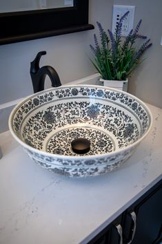 This decorative porcelain, above counter, vessel sink is crafted from the finest materials with the utmost care in the manufacturing process to ensure the final quality meets your needs and expectations and adds that certain touch of individuality to your bathroom. The sink features a decorative flower pattern in black (it also comes in blue). This sink does not need a mounting ring due to its shape, but we recommend that you also purchase a drain with your ceramic sink in the same finish of you Black White Bathrooms, Vessel Bathroom Sink, Plumbing Bathroom, Ming Dynasty, Ceramic Sink, Sink In, Vessel Sink, White Bathroom, Black Ceramic