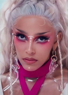 a woman with white hair and pink makeup