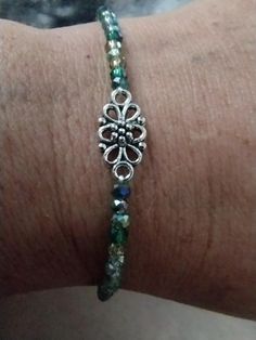 This green 💚 crystal handmade beaded bracelet has a beautiful pendant in the middle and is waiting for a home. Bracelets Handmade Beaded, Green Crystal, Green Crystals, Favorite Things Gift, Wedding Shop, In The Middle, Beaded Bracelet, The Middle, Beauty Book