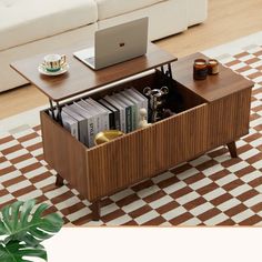 a coffee table with a laptop on top and books in the bottom drawer next to it