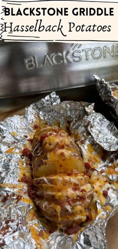 baked potatoes covered in cheese and bacon sitting on tin foil with the title blackstone griddle hasselback potatoes