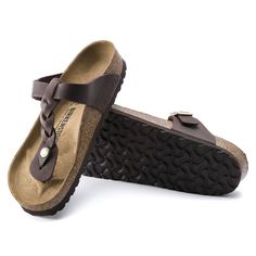 Brown Leather Footbed T-strap Sandals, Leather Toe Post Flip Flops With Cork-bed Midsoles, Brown T-strap Sandals With Cushioned Footbed, Brown Leather Footbed T-strap Slip-on Sandals, Brown T-strap Sandals With Leather Footbed, Brown Toe Post Flip Flops With Rubber Sole, Brown Flip Flops With Rubber Sole And Toe Post, Brown Flip Flops With Toe Post And Rubber Sole, Classic Brown Flip Flops With Leather Footbed