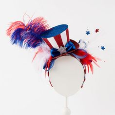 This exotic patriotic headband is the perfect way to celebrate the 4th of July. Cheap American Hats For Memorial Day, Cheap 4th Of July Cap, Cheap Patriotic Cap For 4th Of July, Cheap American Hats For 4th Of July, Cheap Patriotic Adjustable Hats, Cheap American Flag Hat For Memorial Day, Usa Fancy Dress, Patriotic Headband, Patriotic Centerpieces