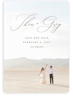 an image of a couple holding hands in the desert for their save - our - date announcement