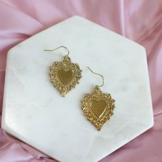 Divine Heart Earrings - Ximena Rosé Jewelry Meaningful Design, Gold Hooks, Rose Jewelry, Stainless Steel Pendant, Pendant Design, Sacred Heart, The Divine, Hook Earrings, Gold Plated Jewelry