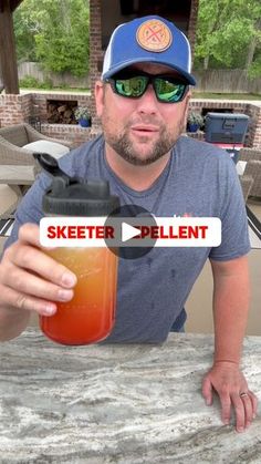 a man sitting at a table with a drink in his hand and the caption skeeter pellett