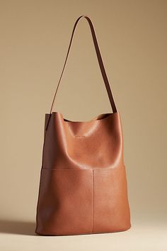 Tall Bucket Bag Modern Bucket Bags For On-the-go, Versatile Leather Pouch Shoulder Bag, Everyday Pouch Bag, Everyday Pouch Shoulder Bag, Versatile Bags With Removable Pouch, Modern Bag With Removable Pouch For Everyday Use, Versatile Pouch Bag For Shopping, Versatile Daily Use Hobo Pouch Bag, Modern Canvas Shoulder Bag For Errands