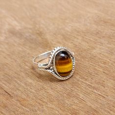 Tiger Eye Silver Ring, Natural Oval Gemstone Ring, 925 Solid Sterling Silver Ring, Statement Boho Ring, Gift For Her, Handmade Ring Gemstone Detail: Gemstone: natural Tiger Eye Stone Size: 14x10 MM Shape: Oval Material: 925 Sterling Silver NOTE: We use good quality gemstone. Therefore they might vary a little in color, hue and reflection. But i assure you will like it. We use base material 925 solid silver then gold plating or rose gold on the ring. If you will do care the ring of gold plating it will go last longer. SHOP JEWELLERYVILLA> https://www.etsy.com/in-en/shop/jewelleryvilla FAST, FREE SHIPPING AND HANDLING TIME Handling Time: We take handling time of 3 Business Day from the date of receipt of the payment after receiving cleared payment.Shipping Services: The shipping company take Oval Sterling Silver Crystal Ring With Polished Finish, Adjustable Oval Hallmarked Crystal Ring, Tigers Eye Gem, Jewellery Ideas, Tiger Eye Stone, Eye Stone, Boho Ring, Ring Gemstone, Boho Rings