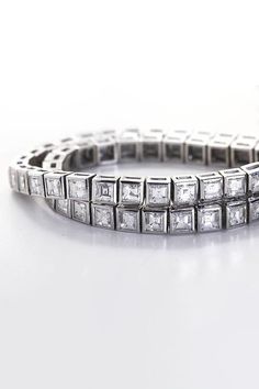 METAL SPECIFICATIONS Metal Name : White Gold 14K STONE SPECIFICATIONS Stone Name : DIAMOND Stone Cut : Princess cut Stone Specifications : There are total diamonds approx. 12 carats. Natural earth mined diamonds. Total Stone Weight : approx. 12.00 carats Color : F/G Clarity : VS2/SI BRACELET SPECIFICATIONS Length : 7" (Can change length, please indicate about change with payment) Appraised Value : $29178.00 Comes with Certificate Luxury Moissanite Bracelet With Single Cut Diamonds, Diamond Baguette Cut Tennis Bracelet, Diamond Tennis Bracelet With 17 Jewels And Baguette Cut, Princess Cut Diamond Bracelet For Wedding, Luxury Princess Cut Diamond Bracelet For Formal Occasions, Exquisite Diamond Tennis Bracelet For Anniversary, Luxury Diamond White Cubic Zirconia Tennis Bracelet, Luxury Diamond Bracelet With Asscher Cut, Luxury Moissanite Tennis Bracelet With Single Cut Diamonds