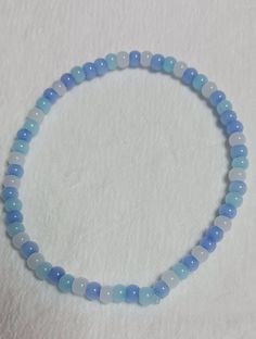 Blue and White Beaded Bracelet Cheap Light Blue Round Beaded Bracelets, Light Blue Friendship Bracelet, Cheap Blue Beaded Chain Bracelets, Cheap Blue Beaded Bracelets, Cheap Light Blue Beaded Bracelets, Cheap Blue Crystal Bracelet With Colorful Beads, Bracelets Baby Blue, Looking At The Sky, Make Clay Beads