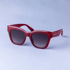 Brighten up your sunny-day looks with the Square Plastic Surf with Metal Sunglasses from A New Day™. The square sunglasses are designed with UV protection lenses to help keep your eyes shielded from sun rays. The red frame complements the gray lenses, while the plastic and metal construction gives it a cool look. A New Day™: Style that goes wherever you do. Red Rectangular Sunglasses With Tinted Lenses, Red Rectangular Polarized Sunglasses, Red Rectangular Sunglasses With Gradient Lenses, Red Rectangular Sunglasses With Mirrored Lenses, Modern Red Rectangular Sunglasses, Modern Red Tinted Shield Sunglasses, Red Rectangular Sunglasses With Uva Protection, Red Modern Shield Sunglasses With Uv Protection, Red Square Frame Sunglasses With Uv Protection