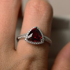 Garnet Emerald Cut Promise Ring, Emerald Cut Garnet Promise Ring, Trillion Cut Birthstone Ring For Promise, Fine Garnet Jewelry For Promise Occasions, Fine Jewelry Garnet For Promise, Trillion Cut Birthstone Promise Ring, Promise Lab-created Ruby Birthstone Ring, Trillion Cut Sterling Silver Ring With Gemstone, Fine Jewelry Garnet Promise Ring