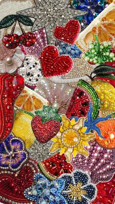 an assortment of beaded and sequins in various shapes, sizes and colors