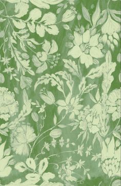 a green floral wallpaper with white flowers and leaves on the bottom half of it