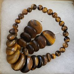 Beautiful Unique Bracelet And Earrings Tiger Eye African Trade Bead Jewelry Woman Shops World, Wooden Necklaces, Wooden Bead Jewelry, Elastic Bracelets, Wooden Necklace, Tiger Eye Beads, Eye Beads, Unique Bracelets, African Jewelry