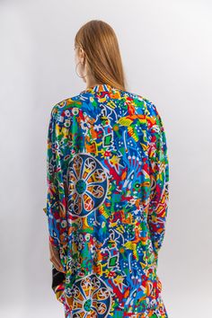 This beautiful tunic with the colorful embroidery is flashy, fun, and extremely comfortable. The dress is made of Egyptian cotton which is widely renowned for its quality and texture. The dress is extremely light and soft and can be used on many occasions - beach, lounge, resort, festivals, theme parties, or just in your home to feel comfortable, fresh and chic. Size : Free sized dress. This tunic is a free sized dress meaning that it comes in one size only that fits any size from a small up to Oversized Printed Multicolor Blouse, Multicolor Long Sleeve Tunic For Beach, Colorful Long Sleeve Blouse For The Beach, Colorful Long Sleeve Blouse For Beach, Patterned Graphic Print Blouse For The Beach, Patterned Blouse With Graphic Print For The Beach, Patterned Graphic Print Blouse For Beach, Beach Blouse With Graphic Print In Patterned Color, Colorful Long Sleeve Beach Blouse