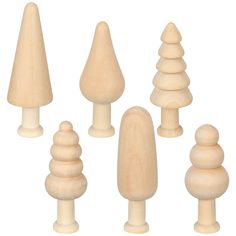 several wooden toy trees are shown on a white background