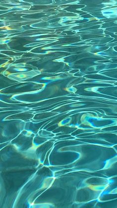 the water is very clear and blue with some ripples on it's surface