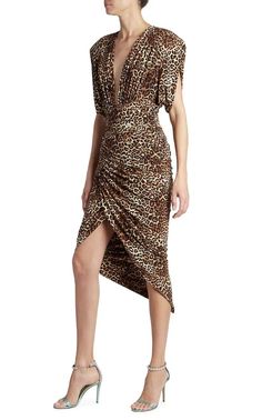 Cut in an asymmetric silhouette, Alexandre Vauthier's leopard-print midi-dress is elevated by structured shoulder pads and a plunging V-neck.Brown leopard printStretch-designRuched detailingV-neckShoulder padsShort sleevesConcealed rear fasteningHigh-low hemComposition: Viscose 95%, Spandex/Elastane 5%Dry Clean Chic Leopard Print V-neck Midi Dress, Fitted Leopard Print V-neck Midi Dress, Chic V-neck Leopard Print Midi Dress, Elegant Leopard Print V-neck Midi Dress, Chic Leopard Print Knee-length Midi Dress, Elegant Leopard Print Midi Dress For Evening, Ruched Leopard Print Dress For Party, Ruched Leopard Print Party Dress, Chic Leopard Print Midi Dress For Party