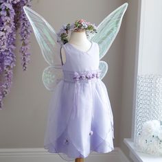 This Little Girl's Fairy Set Is Every Little Girl's Dream! The Dress Can Be Worn By Itself For A Special Occasion Or Add The Wings And Halo And She's Off To Fairy Land! Two Looks For The Price Of One! The Beautiful Lavender Little Girl's Dress Has Lovely Details. Embroidered Lace/Organza Trim At Waist With Lavender Satin And Organza Ribbons Hanging From Lavender And Green Rosettes. Organza Petal Shaped Layers On Skirt Have Satin/Organza Rosettes As Well. Zipper Back With Organza Sash. Lavender P Blush Pink Long Dress, Lavender Flower Girl Dress, Coral Long Dress, Lilac Flower Girl Dresses, Navy Blue Chiffon Dress, Lavender Fairy, Fairy Princess Costume, Pink Bow Dress, Blue Chiffon Dresses