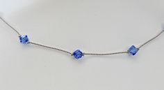 Beautiful, lightweight sapphire September birthstone Swarovski crystal station necklace is handcrafted by me. Unique something blue for bride or dark blue bridesmaid jewelry! Sapphire 6mm Swarovski crystals are hand knotted on grey silk cord. Necklace is lightweight, durable and sits comfortably on your neck. Clasp is sterling silver. Handmade by me in my smoke-free home. I represent the colors in photos as closely as possible. Please be aware that all monitors differ. I ship First Class via the Blue Birthstone Necklace For Wedding, Blue Wedding Birthstone Necklace, Blue Single Strand Wedding Necklace, Nickel-free Blue Necklaces For Wedding, Blue Nickel-free Necklaces For Wedding, Crystal Station, Something Blue For Bride, Blue Choker Necklace, Jewelry Sapphire