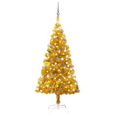 a yellow christmas tree with white and silver ornaments on it's top, against a white background