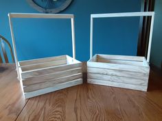 two wooden boxes sitting on top of a table