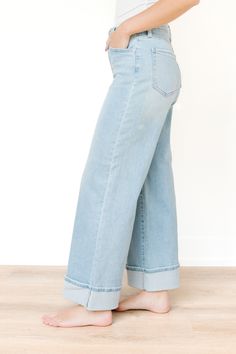 Crafted from high-quality denim fabric, these pants offer durability and versatility, making them suitable for both casual and dressed-up occasions. Whether paired with a tucked-in blouse and heels for a night out or dressed down with a simple tee and sneakers for a relaxed daytime look, these cuffed palazzo pants are sure to become a wardrobe staple.

This pair of chic cuffed palazzo pants is crafted from light denim, offering both style and comfort for any occasion.