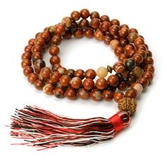 Jasper and Rudraksha 8mm Knotted Mala with Silk Tassel Approx 44" long including 3 1/4" tassel. Strung and knotted on silk cord Bead size : 8mm Adjustable Artisan Mala For Rituals, Traditional Hand Knotted Mala For Meditation, Artisan Adjustable Mala With 108 Beads, Brown Hand Knotted Mala For Healing, Hand Knotted Brown Mala For Healing, Traditional Hand Knotted Mala For Rituals, Traditional Brown Hand Knotted Necklace, Adjustable Brown Mala For Rituals, Adjustable Spiritual Tassel Necklaces