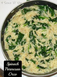 spinach and parmesan cheese in a pan on the stove