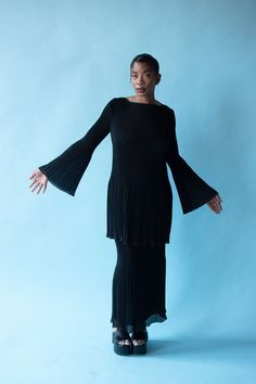 "1990s pleated black set by Vivienne Tam. Elastic waist at skirt. Both fully lined with plastic side zipper on blouse lining. Polyester. - Size Medium -  Labeled size 2  Top Shoulder: 16\"  Bust: 35\" - 36\" at the lining  Waist: 32\" at the lining  Hips: 41\" at the lining  Length: 32\"  Sleeve Length: 23.5\"  Skirt Waist: 28\" - 38\"  Hips: 38\"  Length: 36\"  Condition: Excellent!" Pleated Set, Plisse Dress, Chiffon Pants, Vivienne Tam, Black Set, Velvet Dress, Side Zipper, One Shoulder Dress, Pants Set