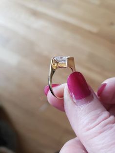 This ring is in 14kt yellow gold and has a 1.5 carat diamonique synthetic diamond. The size is 5 and is sizeable. This ring is bezel set on two sides and open on the other two, this allows the light to come in and makes the ring sparkle. The princess cut stone is set on an angle, and is so beautiful. This ring looks and feels like a million bucks Please don't purchase this on advertising sites and instead visit my store sedonasthings at Etsy thank you Princess Cut Ring, Hot Pink Flowers, Synthetic Diamond, Chenille Pillow, Fredericksburg Va, Princess Cut Rings, Sparkling Rings, The Princess, Princess Cut