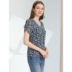 A casual t-shirt is essential to every well-edited wardrobe. Pair this stylish t-shirt with any bottoms to create casual outfits. It is also paired well with shorts or jeans for a chic look. Simple and delicate, this crop top features floral prints, buttons front, a V-neck, and ruched short sleeves. The combination of floral prints and a ruffle hem make this cute top such a beautiful piece. Trendy Summer Short Sleeve Top For Workwear, Trendy Short Sleeve Top For Summer Workwear, Trendy Floral Print Top For Work, Elegant Short Sleeve Top With Floral Print, Elegant Short Sleeve Floral Print Top, Trendy Short Sleeve Top For Work, Elegant Floral Print Crew Neck Top, Elegant Crew Neck Top With Floral Print, Chic Blue Summer T-shirt