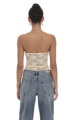 Designed in Los Angeles- Pull-on- Partially lined- Sheer- Made in lace fabric- Hand wash coldModel is wearing a size smallSlight modifications might be made to improve garment quality.Handling the garments with care, hand-washing and air-drying is strongly recommended. Spring Lace Bandeau Top, Lace Bandeau Top For Spring, Spring Bandeau Lace Top, Fitted Lace Bandeau Top, Fitted Strapless Lace Top, Strapless Fitted Lace Top, Fitted Lace Top With Lace Closure, Spring Party Lace With Contrast Detail, Beige Crochet Lace For Spring